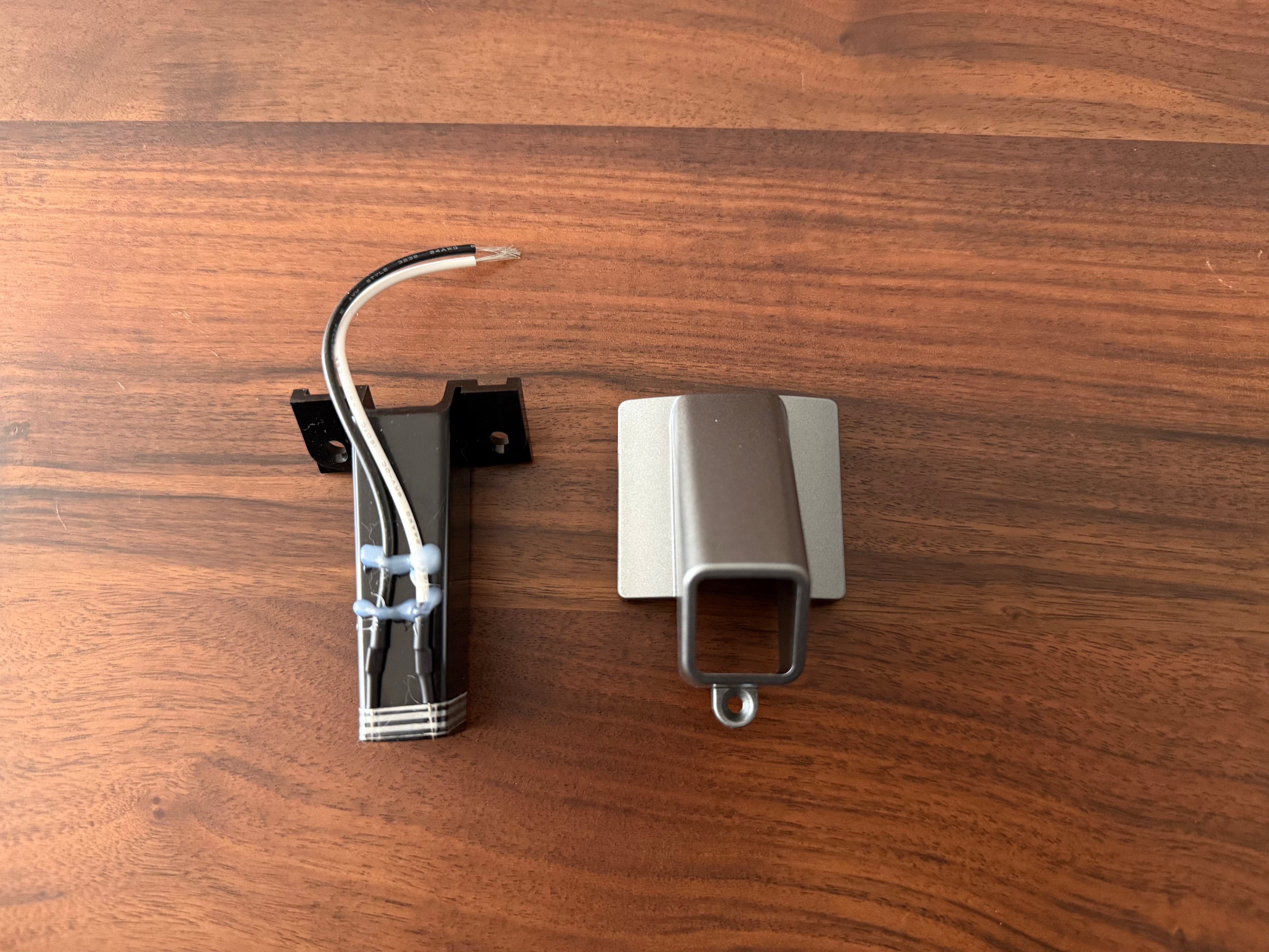 Grey exit chute replacement for DF54 Coffee grinder on wooden surface