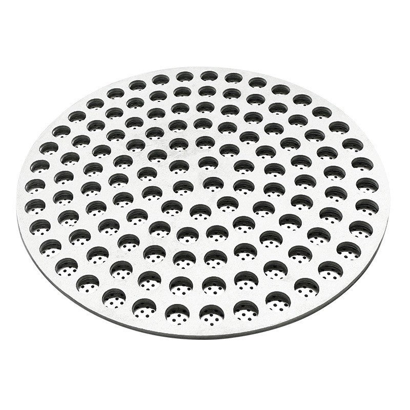 Perforated stainless steel espresso puck screen shown from an angled side view on a white background - Grind Logic