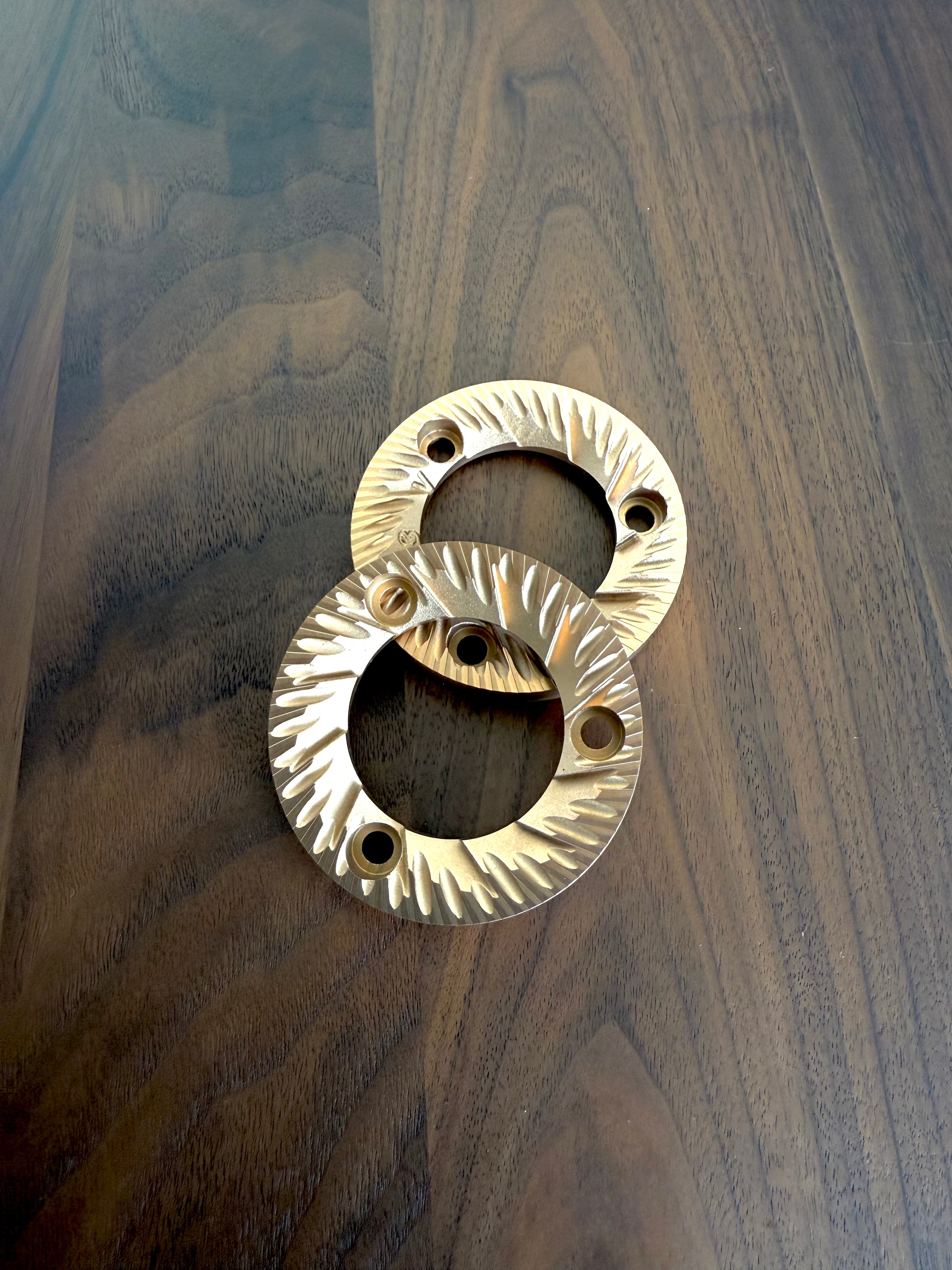 SSP Red Speed coated Lab Sweet (V3) Burrs on a wooden surface