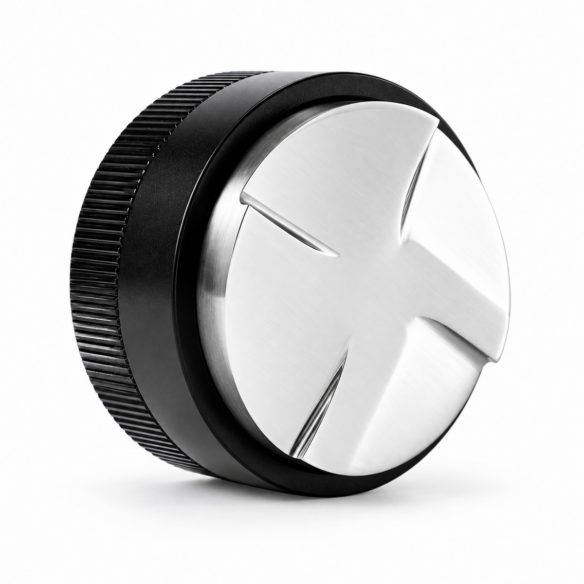 Black Grind Logic coffee distributor angled to show its four-paddle stainless steel base and textured grip