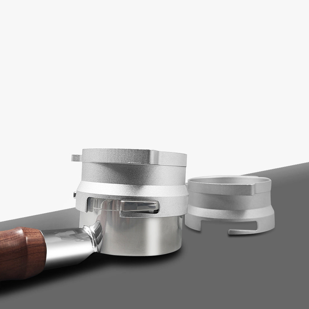 Silver 54mm twist-lock dosing funnel attached to a compatible Breville portafilter - Grind Logic