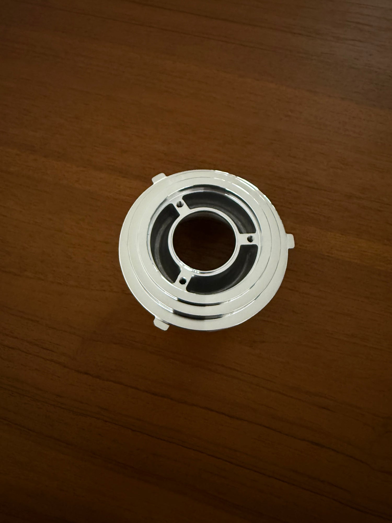 DF54 Upper Burr Carrier - Bottom view on wooden tabletop 