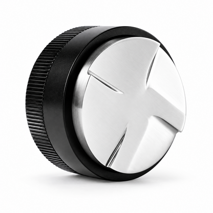 Black Grind Logic coffee distributor angled to show its four-paddle stainless steel base and textured grip