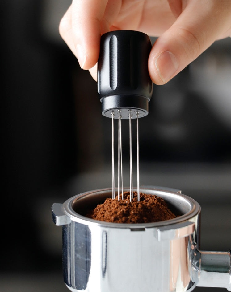 Grind Logic Magnetic WDT Tool distributing coffee grounds in a portafilter
