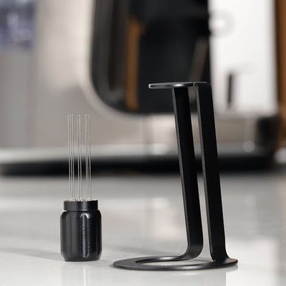 Black Grind Logic Magnetic WDT Tool beside its aluminium stand